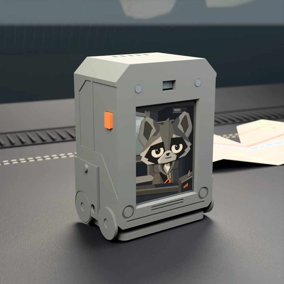 Rasko in a grey bus, with an orange button and an adjustable base.